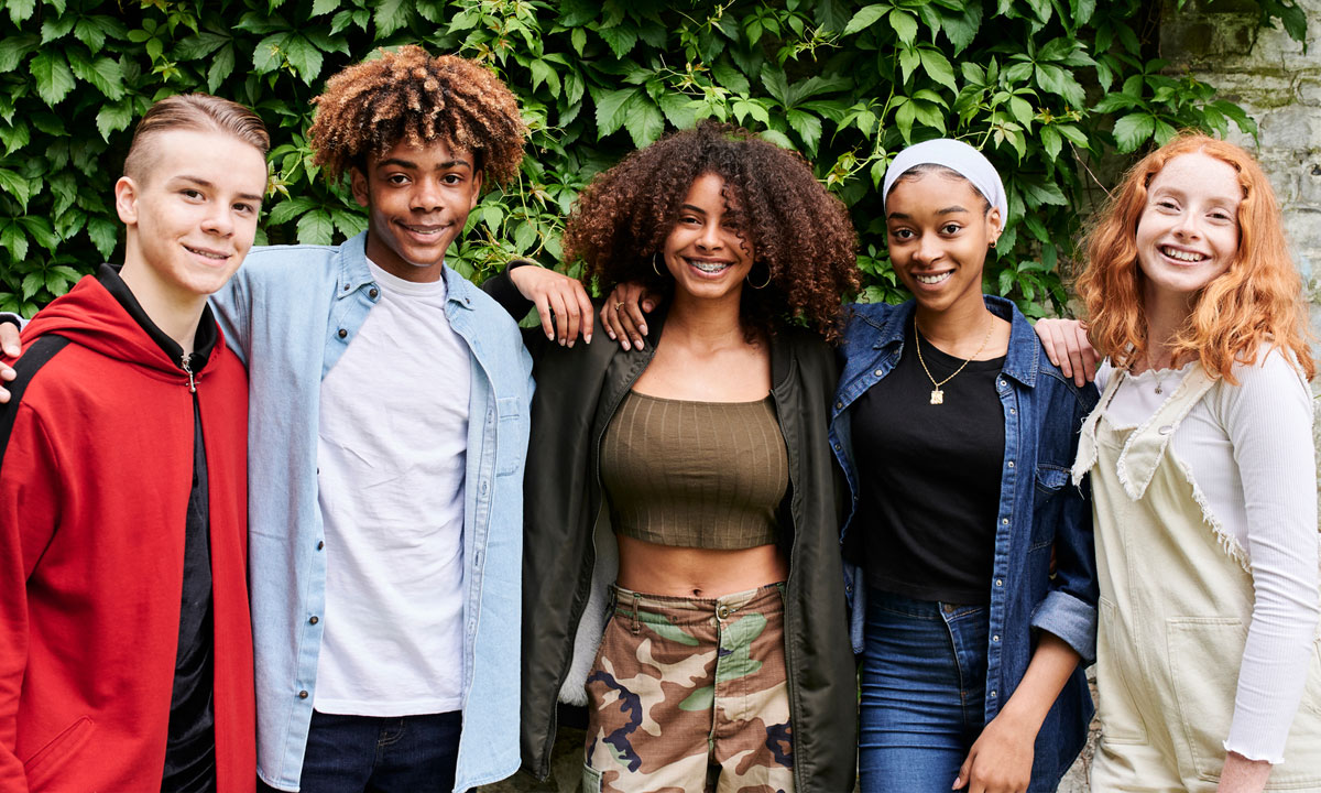 A group of young adults smiling for the camera